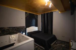 Postel nebo postele na pokoji v ubytování Suite Relax 1