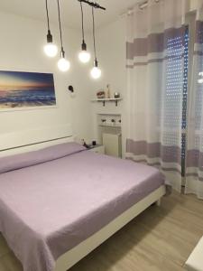 Postel nebo postele na pokoji v ubytování Viola lido adriano