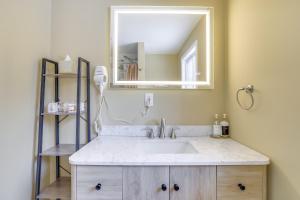 a bathroom with a sink and a mirror at Less Than 7 Mi to Slopes Inviting Pocono Mtn Retreat! in Albrightsville +25 photos