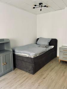 a bed sitting in a room with at Alte Waage in Braunschweig