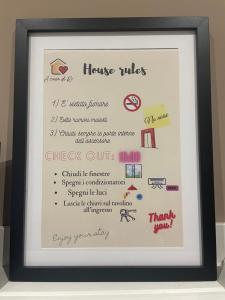 a framed picture of a menu in a black frame at A casa di Ro in Nola