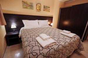Ένα ή περισσότερα κρεβάτια σε δωμάτιο στο Apartamentos Boulevard I +185 φωτογραφίες