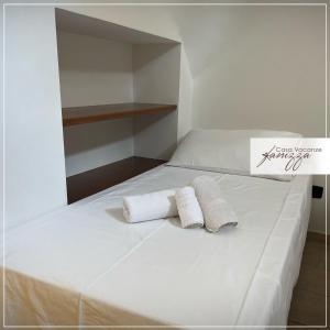 A bed or beds in a room at Trullo Cometa