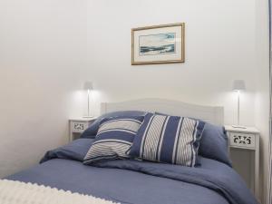 Postel nebo postele na pokoji v ubytování Pie Cottage