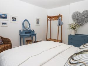 Postel nebo postele na pokoji v ubytování Pie Cottage