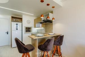 Η κουζίνα ή μικρή κουζίνα στο AIR - Apartamentos bem localizados em Porto Alegre/RS
