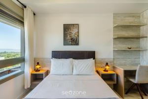 Ένα ή περισσότερα κρεβάτια σε δωμάτιο στο AIR - Apartamentos bem localizados em Porto Alegre/RS