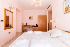 Postel nebo postele na pokoji v ubytování Villa Cassia