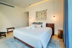 Postel nebo postele na pokoji v ubytování Bloom Tulum Apartments