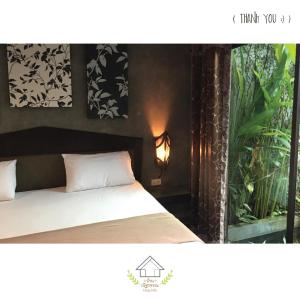 una camera con letto e pianta di บ้านณัฐวรรณ หัวหิน Zone B - Baan Nattawan Huahin Zone B a Hua Hin Altre 32 foto