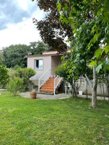 a house with a staircase in a yard at La Fincurri del Nando in A Coruña