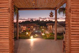 a view of a patio with lights at night at Cabana Serena in Corumbau