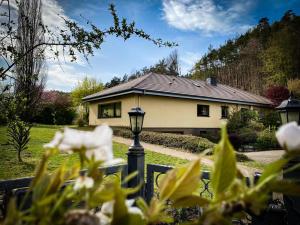 a house with a street light in front of it at Villa Münchweiler in Münchweiler Rodalb +6 photos