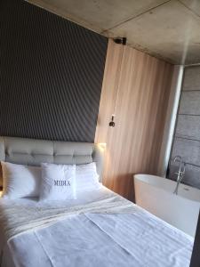 Letto o letti in una camera di MIDIA Guest House