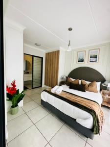 Ένα ή περισσότερα κρεβάτια σε δωμάτιο στο The Blyde Luxury Crystal Lagoon