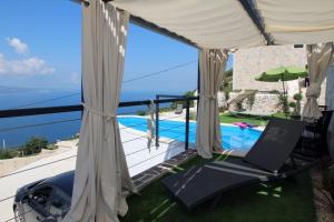 a villa with a view of the swimming pool at Mountain Stone Villa with pool in Stanići