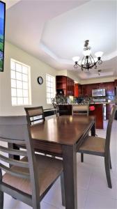 a dining room with a wooden table and chairs at Tijuana Beach View & Patio in Tijuana +22 photos
