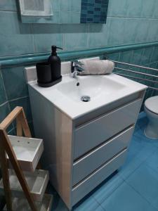 a bathroom sink with a soap dispenser on top of it at Nuevo, junto al Ayuntamiento y Casco Viejo in Bilbao