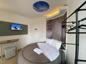 Postel nebo postele na pokoji v ubytování SSA 33 Hotel