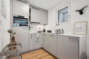 Kuhinja oz. manjša kuhinja v nastanitvi INN JOY Apartments - Cozy Ski Oase