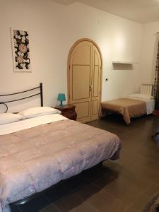 Postel nebo postele na pokoji v ubytování B&B Villa Lidia