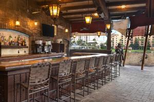 a bar with a row of chairs at a bar at Club Wyndham Bonnet Creek in Orlando