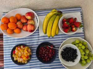 a group of bowls of fruit on a table at St. Hilary Guest House in Llandudno +34 photos