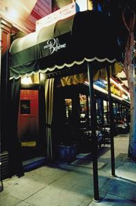 a restaurant with awning on the side of a building at Hotel Boheme in San Francisco