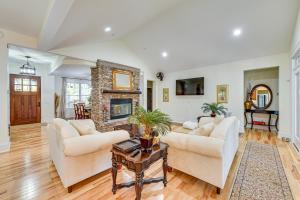a living room with two couches and a fireplace at Fire Pit and Patio Spacious Southern Pines Retreat in Southern Pines