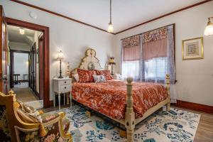 a bedroom with a bed and a large window at Classic 4BR Bowery Hill Gem Near Top Spots in Omaha +40 photos