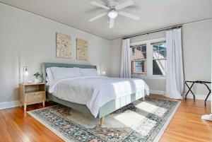 a bedroom with a bed and a ceiling fan at Elegant 3BR Oasis in Dundee Close to Downtown in Omaha