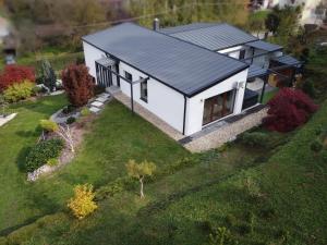 an aerial view of a white house with a garden at Alsóerdő Villa Resort in Zalaegerszeg
