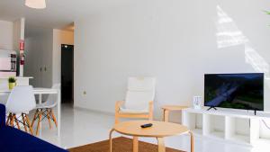 TV a/nebo společenská místnost v ubytování Arecibo Hotel 2103