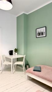 Łóżko lub łóżka w pokoju w obiekcie Beautiful Rooms - Wały Chrobrego