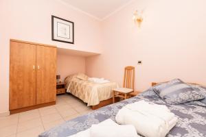 Postel nebo postele na pokoji v ubytování Villa Cassia