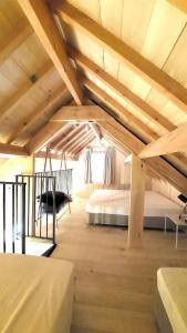 Postel nebo postele na pokoji v ubytování Boerderaaj vakantiewoning