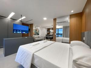 Et tv og/eller underholdning på Flat Espaçoso no 8º Andar do Prime