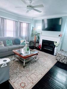 a living room with a couch and a fireplace at Cozy Home By University Circle VA,CC & Museum in Cleveland
