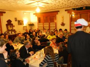 a group of people sitting at tables in a room at Albergo Ristorante Villa Svizzera in Vidiciatico