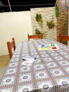 a table with a blue and white table cloth on it at Lucena House in Lucena