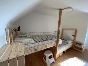 a bedroom with a bunk bed in a room at Family Friendly Mountain House in Eisenerz