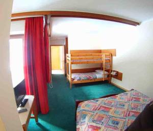Postel nebo postele na pokoji v ubytování Hotel Canin