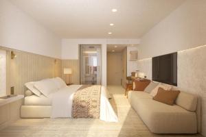 a bedroom with a large bed and a couch at Villa Dubrovnik in Dubrovnik