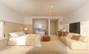 a bedroom with a bed and a couch and a television at Villa Dubrovnik in Dubrovnik