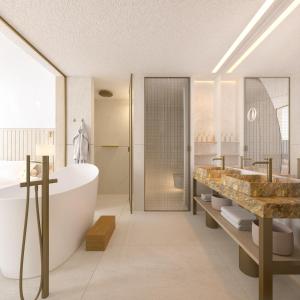 a bathroom with a tub and two sinks and a shower at Villa Dubrovnik in Dubrovnik