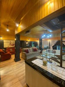 Posezení v ubytování Casa de Pedra Espaçosa na Fazenda