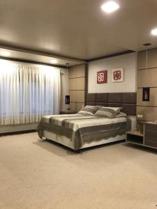 Postel nebo postele na pokoji v ubytování Casa de Pedra Espaçosa na Fazenda