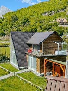 a house with a metal roof on top of it at Villa Logu in Theth