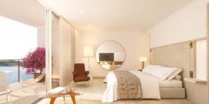 a bedroom with a bed and a chair and a mirror at Villa Dubrovnik in Dubrovnik