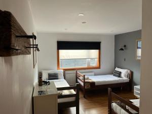Voodi või voodid majutusasutuse Pristine Patagonia Hotel toas